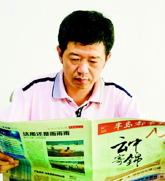 21|半岛都市报相伴21载 通过新闻传递情谊